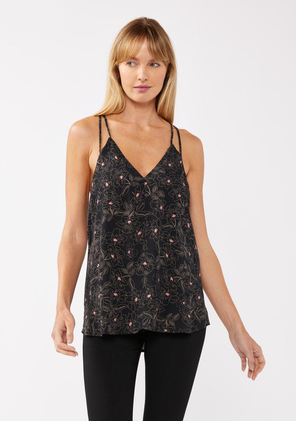 [Color: Black/Rose] A model wearing a black and pink floral tank top with racerback detail, a v neckline, and a strappy tie neck. This relaxed fit tank top is perfect for the office or casual laid back days. 