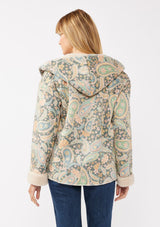 [Color: Midnight/Blush] A back facing image of a blonde model wearing a green paisley and floral print jacket with a sherpa lining. A boho statement jacket with long sleeves, patch pockets, a hoodie, and a cozy draped silhouette for warmth and comfort. Styled with denim for a casual fall or winter look. 