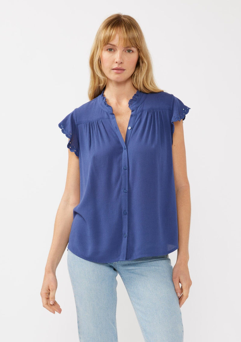 [Color: Ink Blue] A front-facing image of a blonde model wearing a light yellow crinkled rayon top. The top features flutter sleeves with eyelet details, a split V-neckline, and a button-front design, offering a versatile look for everyday wear.