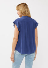 [Color: Ink Blue] A back-facing image of a blonde model wearing a light yellow crinkled rayon top. The top features flutter sleeves with eyelet details, a split V-neckline, and a button-front design, offering a versatile look for everyday wear.