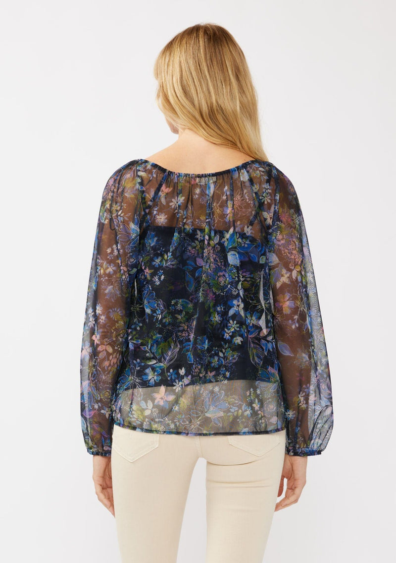 [Color: Black/Dusty Pink] A back facing image of a blonde model in a navy sheer micro mesh blouse with floral print, featuring long sleeves, tie-front detail, elastic cuffs, and cami lining; perfect for evening and casual chic styling.