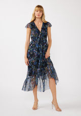 [Color: Black/Dusty Pink] A front facing image of a blonde model wearing a micro mesh flowy maxi dress with a navy blue floral print. This faux wrap dress features a flattering v-neckline, short flutter sleeves, and a ruffle trimmed hem. Perfect for special occasions, weddings, and formal dinners. 