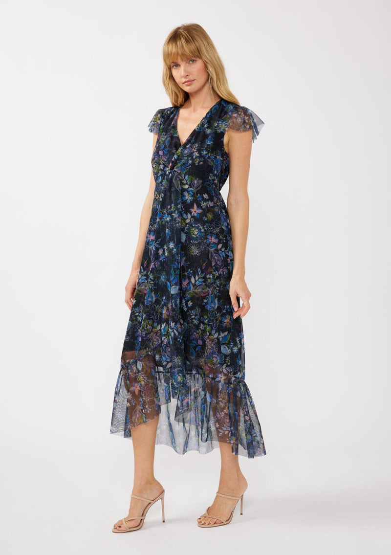 [Color: Black/Dusty Pink] A side facing image of a blonde model wearing a micro mesh flowy maxi dress with a navy blue floral print. This faux wrap dress features a flattering v-neckline, short flutter sleeves, and a ruffle trimmed hem. Perfect for special occasions, weddings, and formal dinners. 