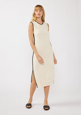 [Color: Natural/Black] A front facing image of a blonde model wearing an off white tank midi dress crafted in a stripe knit texture with a round neckline, side slits, and a black contrast stitch trim. A casual throw-on for vacation, resort styling, and lounging. 