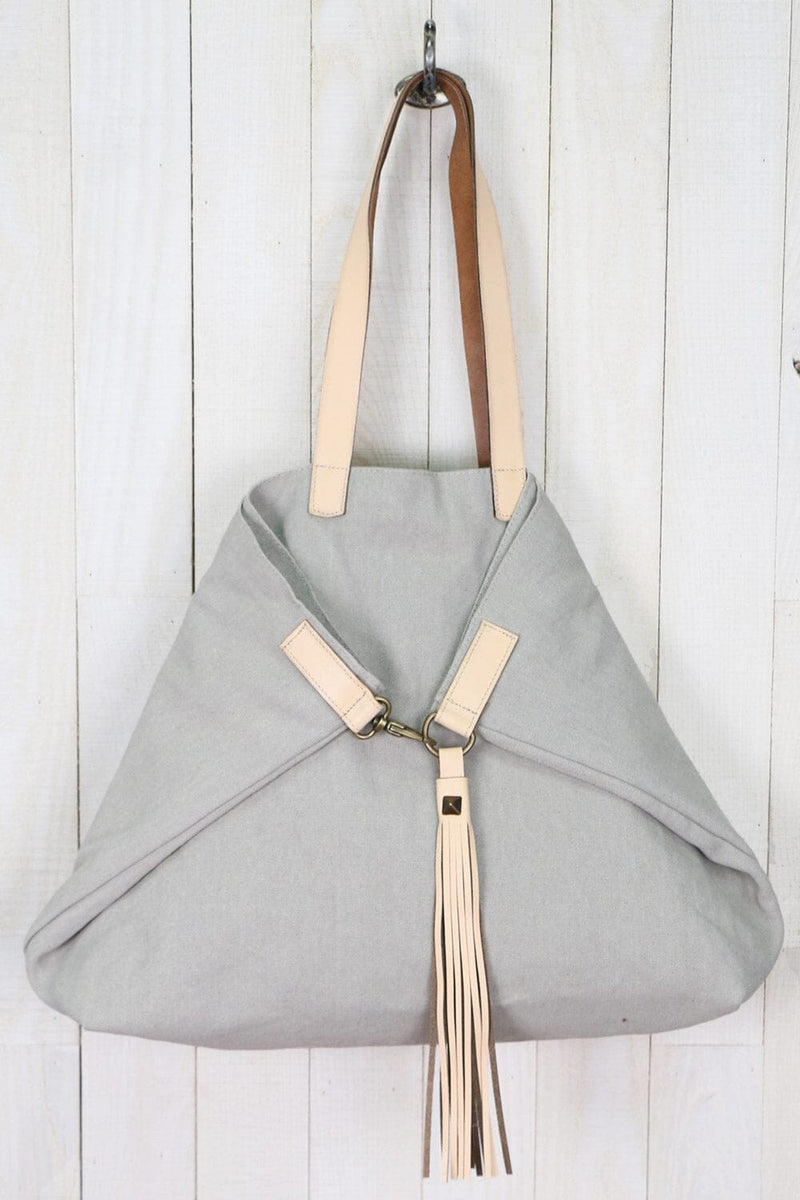 [Color: Chiccio/Meile] A large grey cotton tote bag with contrasting leather accents, featuring a spacious design, swivel hook for easy compression, and a stylish tassel detail.