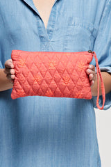 [Color: Pink Combo] A pink boho embroidered zipper pouch with a quilted back and stud accents. Complete with an attached wristlet strap for easy carrying. 