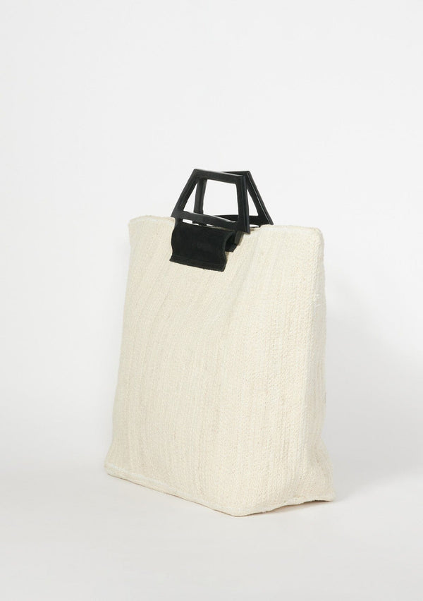 [Color: Natural] A large off white ivory tote bag with a woven cotton feel with wood handles. A vacation style tote with a flimsy structure, perfect for the beach or to take for travel.