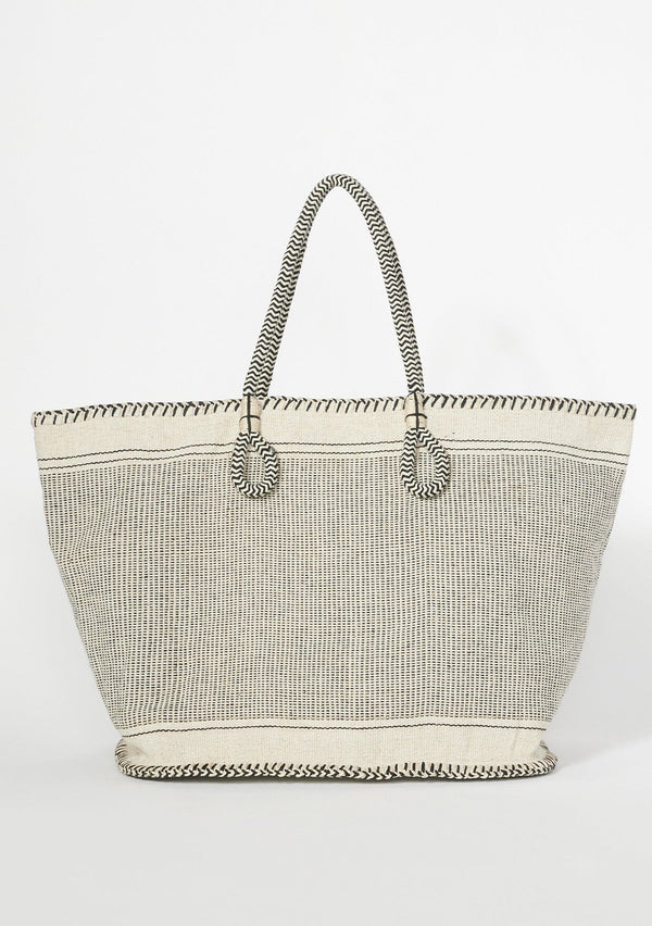 [Color: Natural/Black] A bohemian tote bag in a natural and black texture. With stitched detail throughout, two rope handles, and a zip closure.