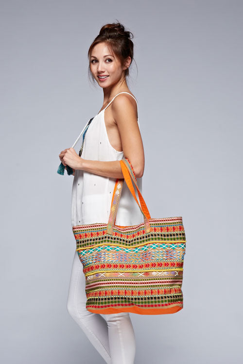 [Color: Orange/Multi] A vibrant, multi-color jacquard tote bag featuring long shoulder straps and a contrasting interior for a stylish touch. 