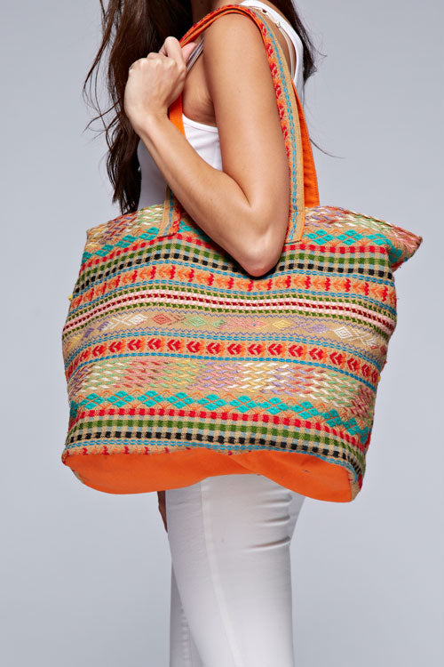 [Color: Orange/Multi] A vibrant, multi-color jacquard tote bag featuring long shoulder straps and a contrasting interior for a stylish touch. 