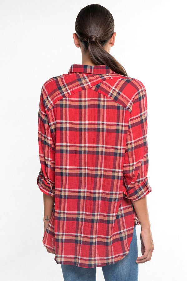 [Color: Red] A back facing image of a brunette model wearing a red plaid button down shirt with long roll tab sleeves, a collared neckline, and a shirttail hemline. Perfect for casual
outings and campfire activities. 