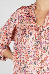 [Color: Desert Rose/Teal] Lovestitch pink floral, silken peasant top with a lattice trim, split v-neckline with tie detail, and 3/4 sleeves. Perfect modern boho blouse for casual outings. 