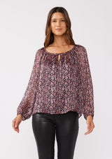 [Color: Black/Plum] A front facing image of a brunette model wearing sheer lurex stripe top with a standout purple floral print. This holiday blouse features long sleeves, elastic cuffs, and a scoop neckline with a tie front detail. Elegantly styled for the holiday season and special occasions. 