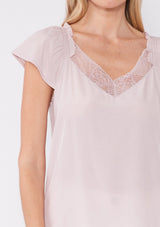 [Color: Dusty Pink] Crafted in a soft dusty pink hue, this top features flattering cap sleeves and a delicate lace-trimmed V-neckline, adding a touch of feminine charm. The lightweight fabric drapes beautifully, offering a relaxed yet polished look that's ideal for any occasion. Pair it with your favorite denim for a casual day out or dress it up with a skirt for a chic evening ensemble. Embrace timeless style with this versatile and sophisticated piece.