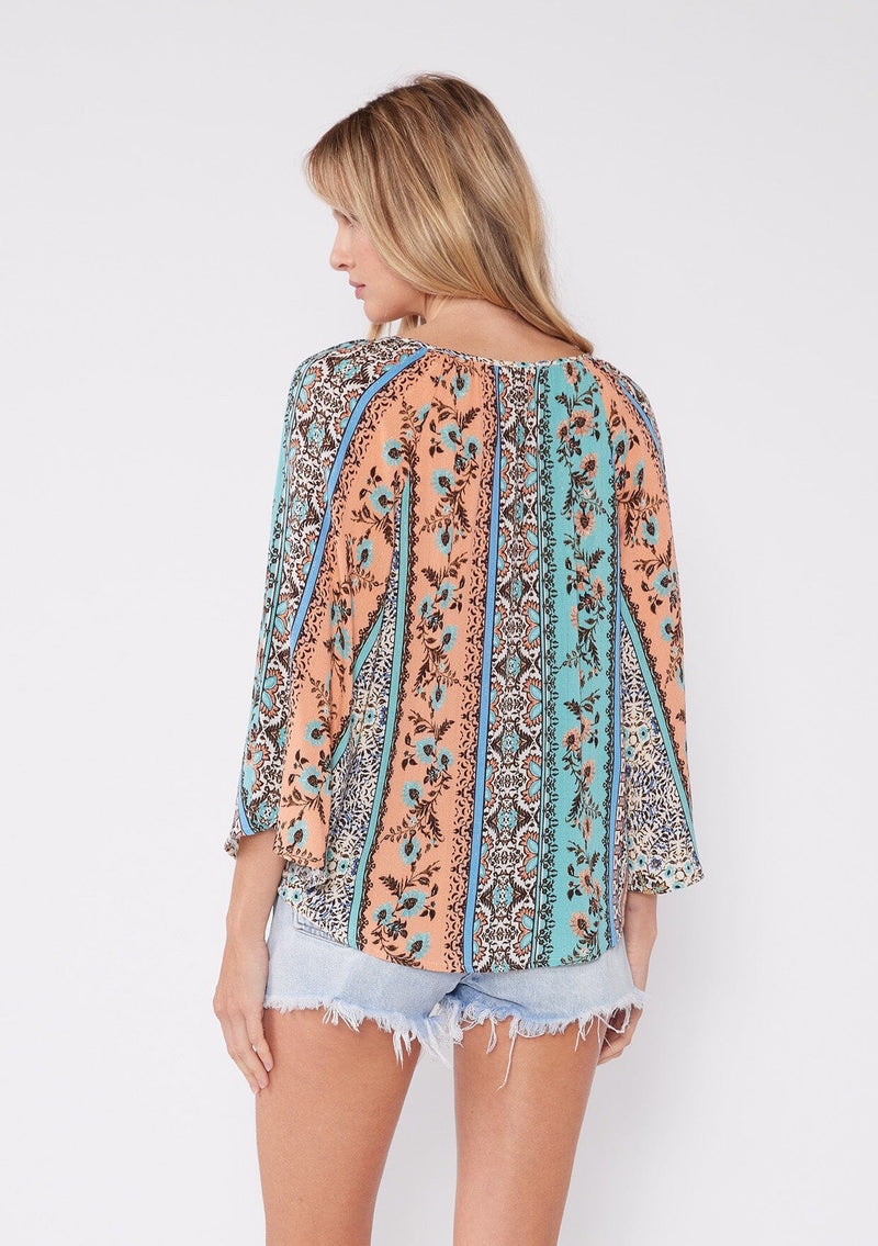 [Color: Natural/Tangerine] Beautiful bohemian print patchwork floral blouse with a deep v neckline and billowy three quarter length sleeves. The perfect summer vacation top. 