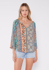 [Color: Natural/Tangerine] Beautiful bohemian print patchwork floral blouse with a deep v neckline and billowy three quarter length sleeves. The perfect summer vacation top. 