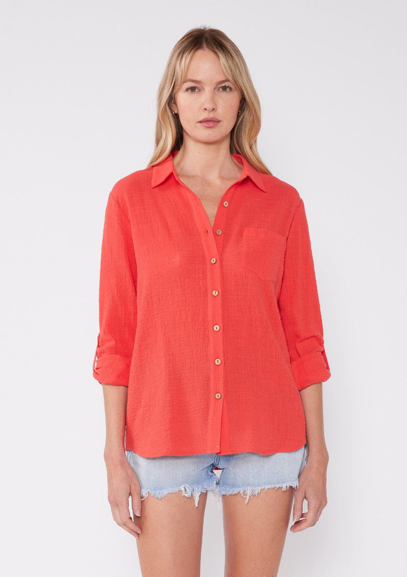 [Color: Coral] breathable cotton blouse with comfortable roll tab sleeves and button cuffs. Features a classic collared neckline, functional button front, and patch pocket. An everday versatile top for the Summer season.