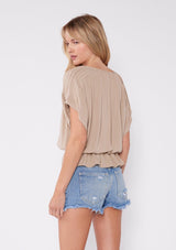 [Color: Taupe] Tan beige bohemian chic peplum top with a cute button front detail and flattering short sleeves with pleated details. 