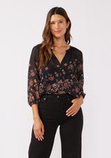 [Color: Black/Dusty Rose] A front facing image of a brunette model wearing a sheer chiffon black blouse with a pink floral print. A lightweight top featuring a button front, split v neckline, and 3/4 length sleeves. Ideal for special occasions and holiday events. 