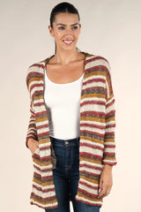 [Color: Natural/Burgundy Multi] A front facing image of a brunette model wearing a cozy striped knit cardigan with subtle metallic thread accents. Featuring a relaxed dropped shoulder and side patch pockets.