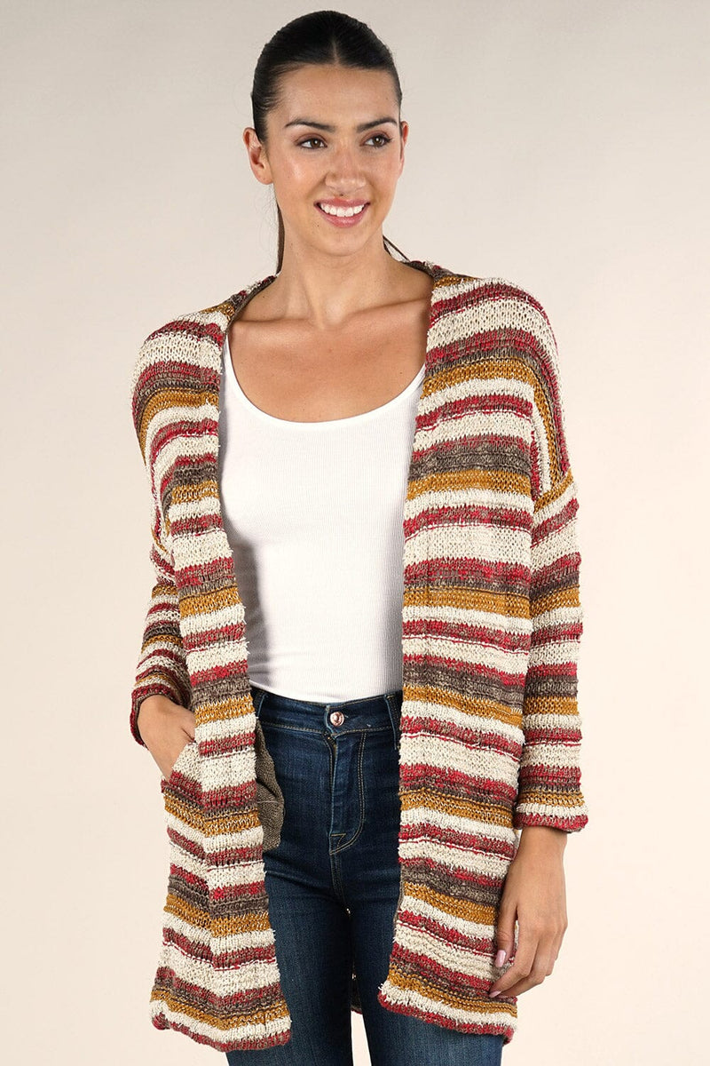 [Color: Natural/Burgundy Multi] A front facing image of a brunette model wearing a cozy striped knit cardigan with subtle metallic thread accents. Featuring a relaxed dropped shoulder and side patch pockets.