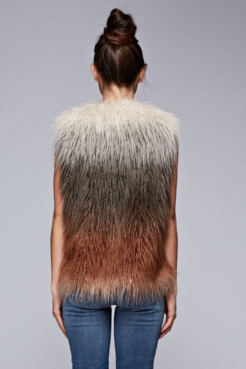 [Color: Vanilla/Grey/Rust] A back facing image of a brunette model wearing a ultra chic bohemian faux fur vest with an ombre design. 