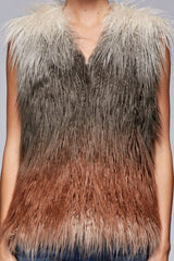 [Color: Vanilla/Grey/Rust] A detail image of a brunette model wearing a ultra chic bohemian faux fur vest with an ombre design. 