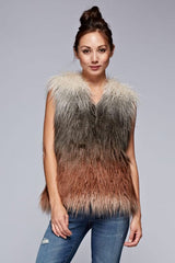 [Color: Vanilla/Grey/Rust] A front facing image of a brunette model wearing a ultra chic bohemian faux fur vest with an ombre design. 