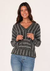 [Color: Black/Grey] A front facing image of a brunette model wearing a striped pullover hoodie with a drawstring and front kangaroo pocket. A versatile sweater, perfect for casual outings or beach styling. 