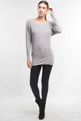 [Color: Heather Ash] A front facing image of a brunette model wearing a relaxed fit pullover grey sweater with long dolman sleeves, a round neckline, and a fitted hem. A long torso sweater perfect for casual outings and lounging. 