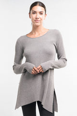 [Color: Heather Ash] A brunette model wearing a grey waffle knit pullover lounge sweater with a crew neckline, long sleeves, and a long hemline with side slits. A basic casual top for everyday styling. 