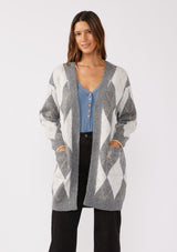 [Color: Charcoal/Grey] A front facing image of a brunette model wearing an ultra-soft mid length cardigan in a grey and light grey argyle plaid pattern. With long sleeves, an open front, and side pockets.