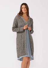 [Color: Charcoal] A full body front facing image of a brunette model wearing a dark charcoal grey open knit cardigan sweater. A mid length lightweight cardigan with long sleeves, an open front, and ribbed wrist cuffs.