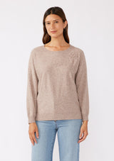 [Color: Heather Mocha] A front facing image of a brunette model wearing a casual light brown pullover sweater with tonal embroidery. This lightweight fall sweater features long sleeves, a classic round neckline, and rib trimming. 