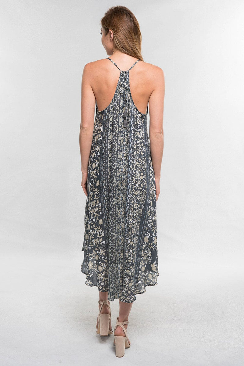 [Color: Charcoal/Mint] A blonde model wearing a floral boho midi dress with a sleeveless design, halter neck tie, racerback, and a handkerchief hemline. 