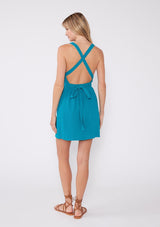 [Color: Teal Blue] An effortless chic mini dress for warm weather. This dress was crafted from breathable cotton gauze, ideal for the summer season. A teal dress with a flattering v neckline, elastic waist, and a strappy body design that makes a criss cross back that ties at the waist.