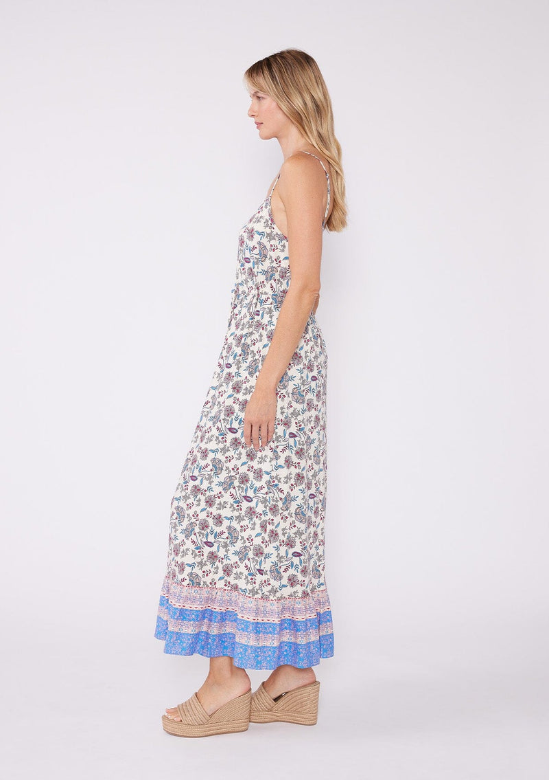 [Natural/Magenta] A pretty white summer maxi dress featuring vintage inspired pink and blue floral print, an adjustable cinched tie waist, spaghetti straps and a flowy tiered ruffle hem.
