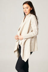 [Color: Grey/Ivory] A beautiful chunky ivory knit cardigan with a shawl collar and ribbed detail. A western fall style waterfall cardigan with a cascading open front, long sleeves, and cozy side pockets. 