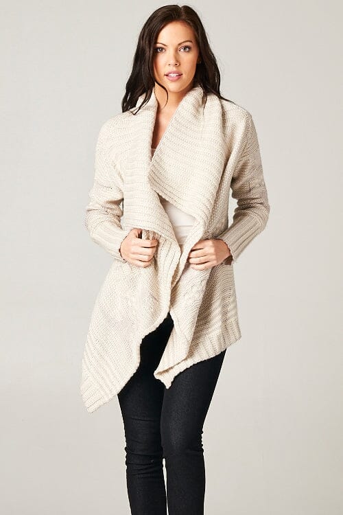 [Color: Grey/Ivory] A beautiful chunky ivory knit cardigan with a shawl collar and ribbed detail. A western fall style waterfall cardigan with a cascading open front, long sleeves, and cozy side pockets. 