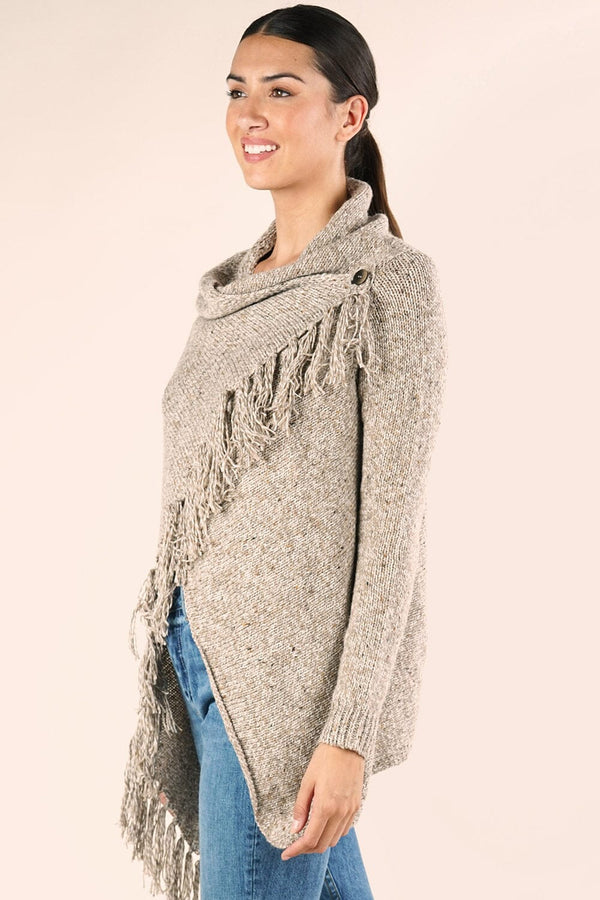 [Color: Camel] A brunette model wearing a light brown speckled cardigan with an asymmetrical wrap design, cowl neckline, and fringed hemline. 