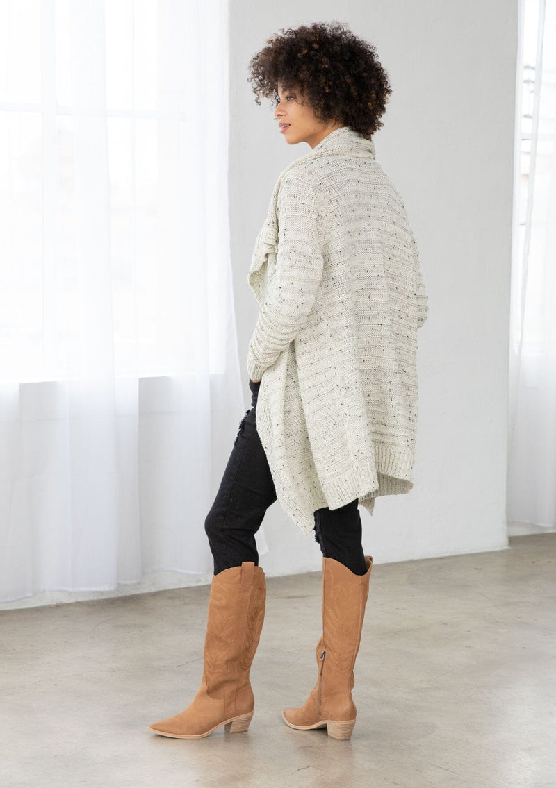 [Color: Cream/Black] A bohemian speckled knit grey cardigan with long sleeves, an open front, and an oversized lapel. 