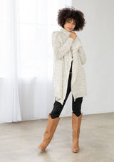 [Color: Cream/Black] A bohemian speckled knit grey cardigan with long sleeves, an open front, and an oversized lapel. 