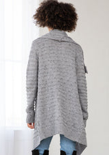 [Color: Grey/Black] A bohemian speckled knit grey cardigan with long sleeves, an open front, and an oversized lapel. 