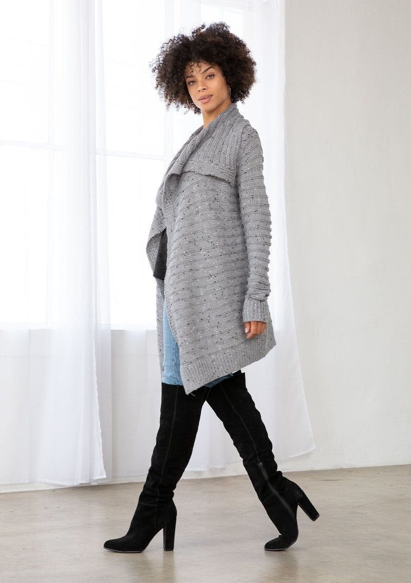 [Color: Grey/Black] A bohemian speckled knit grey cardigan with long sleeves, an open front, and an oversized lapel. 