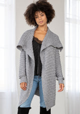 [Color: Grey/Black] A bohemian speckled knit grey cardigan with long sleeves, an open front, and an oversized lapel. 