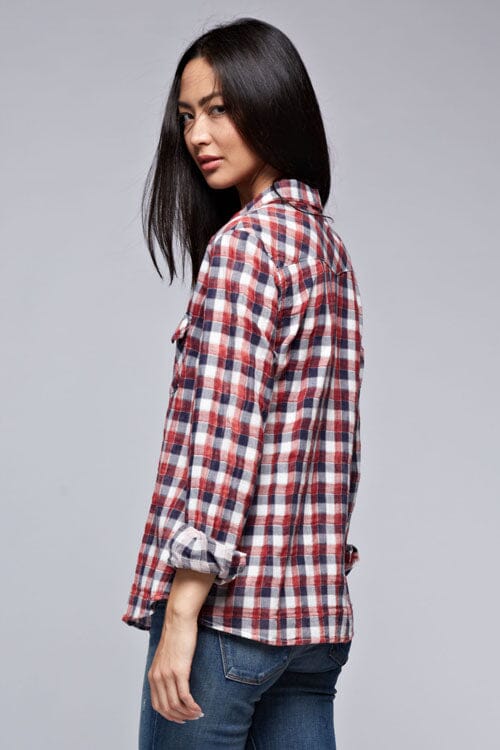 [Color: Cream/Multi] A brunette model wearing a red blue plaid shirt with a collared neckline, snap button front, long sleeves, and patch pockets. 