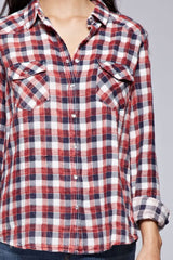 [Color: Cream/Multi] A brunette model wearing a red blue plaid shirt with a collared neckline, snap button front, long sleeves, and patch pockets. 