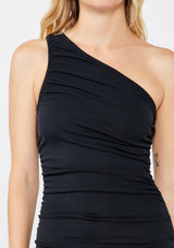 [Color: Black] A classic day to night mini dress in black. With an asymmetrical hemline, ruched sides, and off shoulder design. Features a slim fit silhouette in a soft ribbed knit fabric that's both comfortable and stylish.