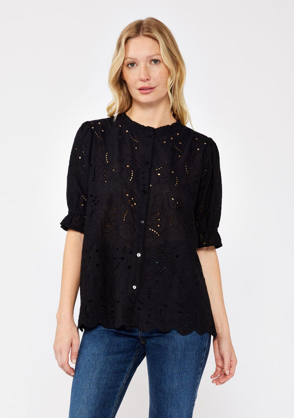 [Color: Black] A blonde model wearing a black top with a high round neckline, button front, and puff sleeves. Features a ruffled elastic cuff for added flair. A summer top with no lining for a comfortable breezy fit for the summer. 