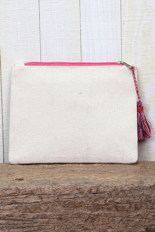 [Color: Pink Multi] An image of a multi color embroidered clutch with light reflecting details and a tassel zipper pull. 